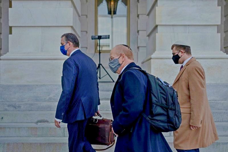 Attorneys for former President Donald Trump, Bruce Castor and David Schoen arrive prior to the start of the impeachment trial at the Capitol in Washington, on Feb. 10, 2021.