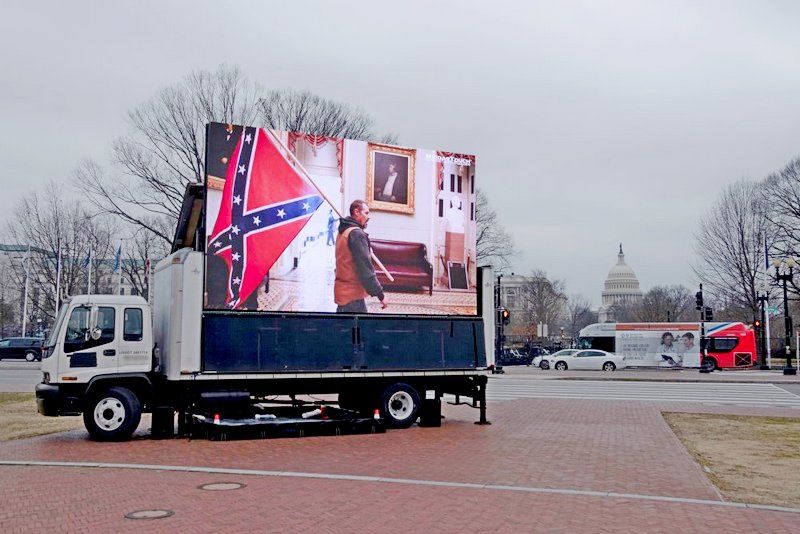 A truck operated by the SuperPAC Meidas Touch shows scenes from the insurrection outside Union Station during the impeachment trial of former president Donald Trump in Washington, on Feb. 10, 2021.