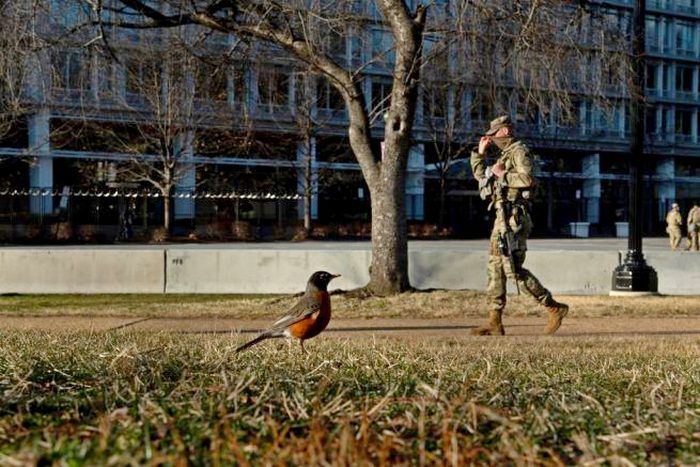 A member of the National Guard walks a security perimeter surrounding the US Capitol building on Capitol Hill on March 4, 2021, in Washington, DC. - The grounds of the US Capitol were ringed with boosted security Thursday after officials warned of an attack plot by QAnon conspiracists, two months after backers of ex-president Donald Trump stormed the Capitol building. (Photo by Brendan Smialowski / AFP) (Photo by BRENDAN SMIALOWSKI/AFP via Getty Images)