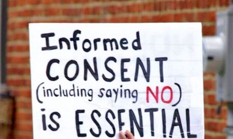 A protester holds a sign at a Pennsylvania rally in support of Penn Medicine workers. (Courtesy of   Pennsylvania Informed Consent Advocates Inc.)