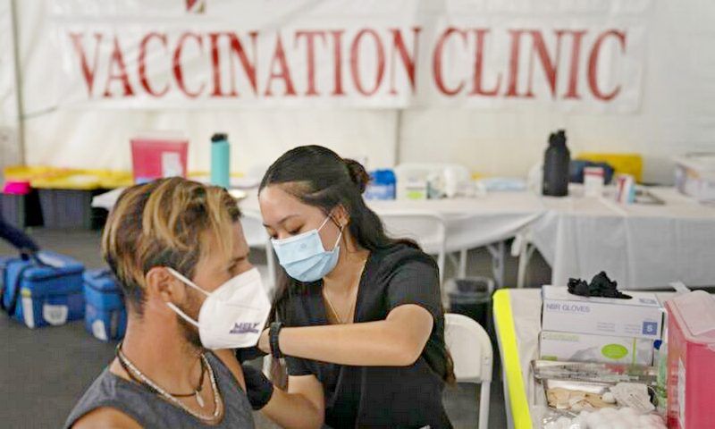 A nurse administers a COVID-19 vaccine in Orange, Calif., on Aug. 28, 2021. (Jae C. Hong/AP Photo)