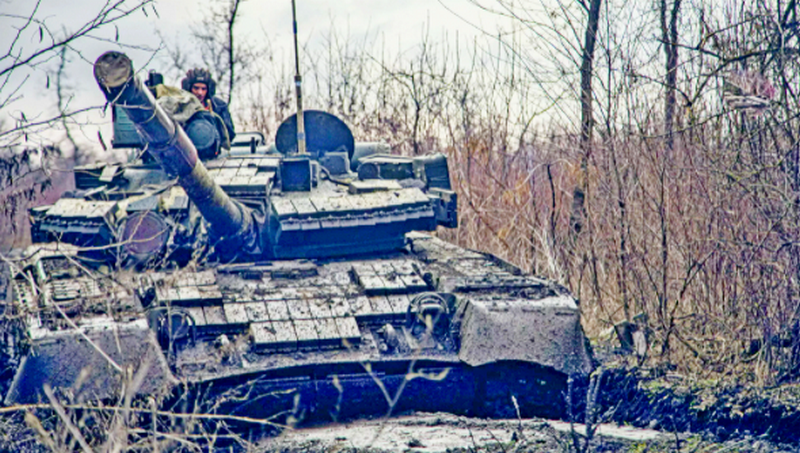 A service member of the Ukrainian Naval Infantry Corps (Marine Corps) rides a tank during drills at a training ground in an unknown location in Ukraine, in this handout picture released February 18, 2022 - Sputnik International, 1920, 27.02.2022
