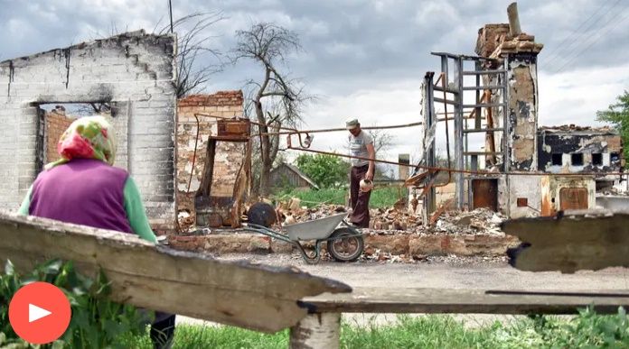 Navozenko Anatolii  cleans the debris of his house in Novoselivka village, Chernihiv region, Ukraine.