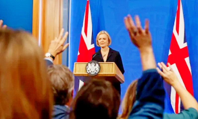 Liz Truss faces questions from the media at a press conference in which she U-turned over corporation tax.