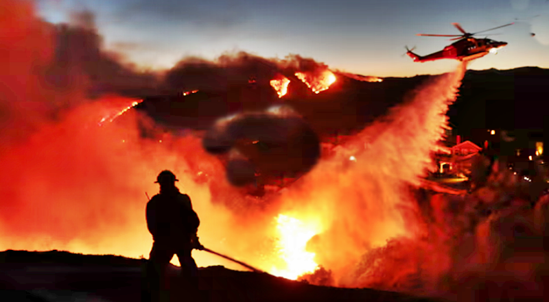 California wildfires live: more than 1,400 firefighters tackling three separate fires around LA